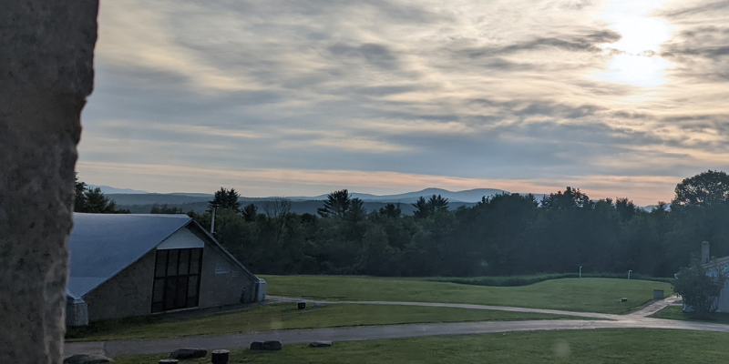 office view of mountain and trees, building, green grass